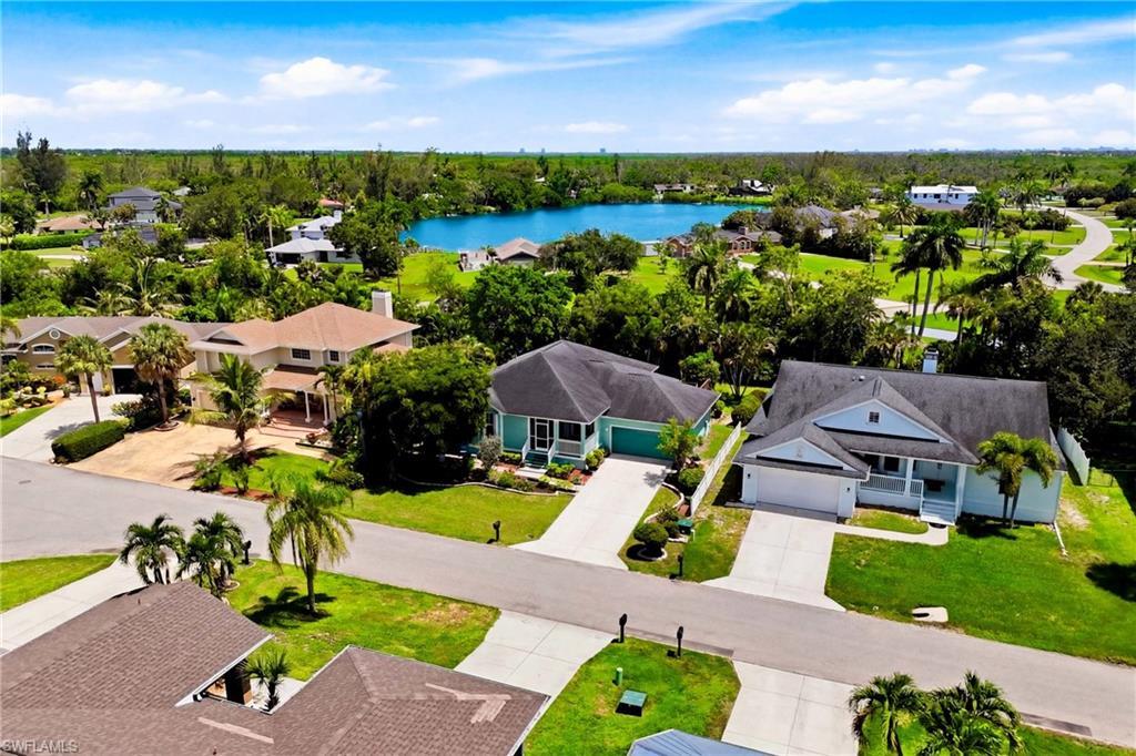 Image 2: Aerial showcase of the property&rsquo;s inviting exterior and exceptional location close to beaches, shopping, dining, and everyday conveniences.