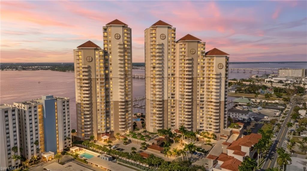 Image 3: View of building exterior with a water view and a view of city