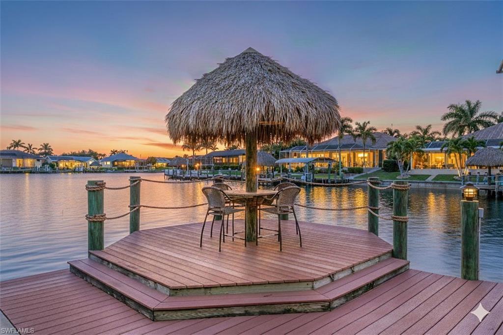 Image 2: Relaxing sunset views from the dock!
