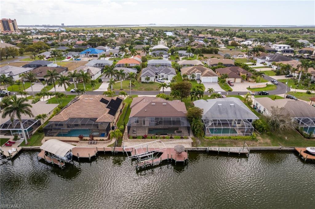 Image 3: Aerial view of back of home and 150 foot wide Gulf access canal.