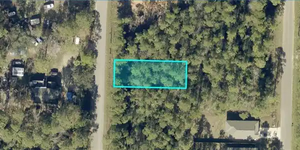 Image 2: Aerial Site Map. Illustrating the boundaries of the property outlined in blue