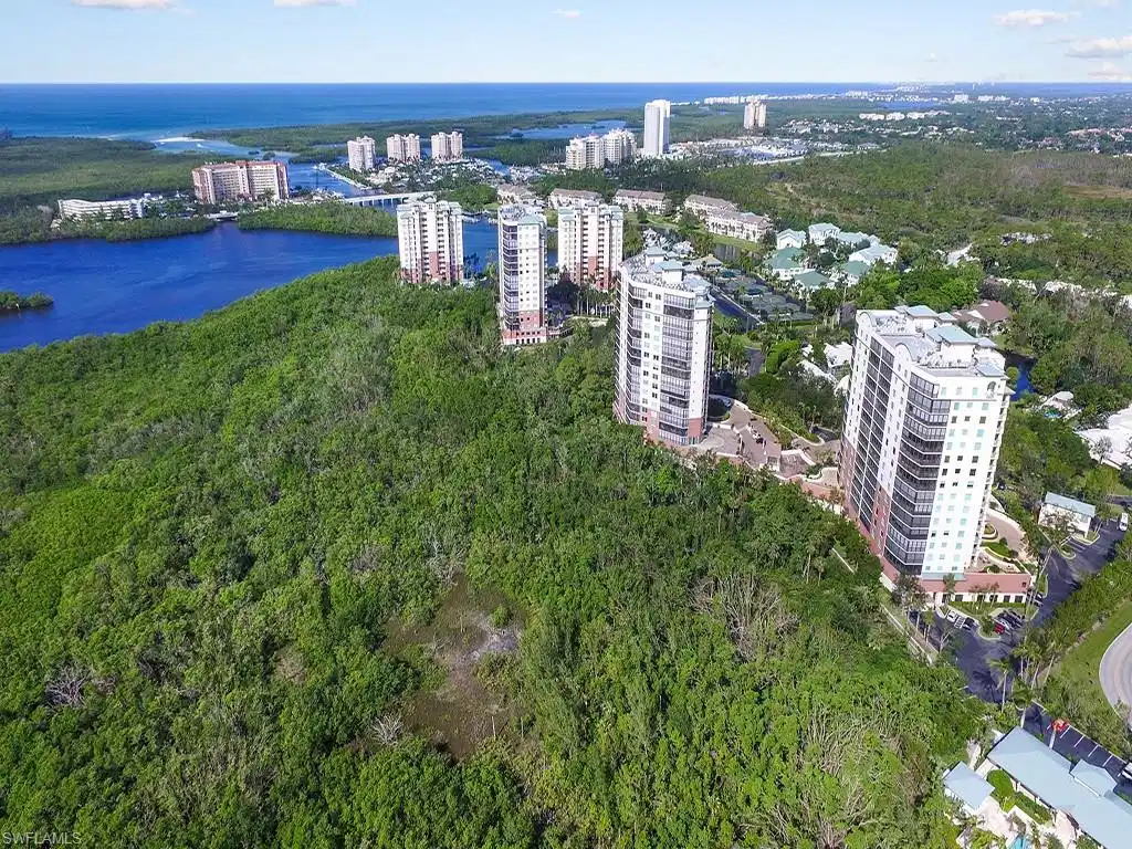 Image 1: Bird's eye view featuring a water view