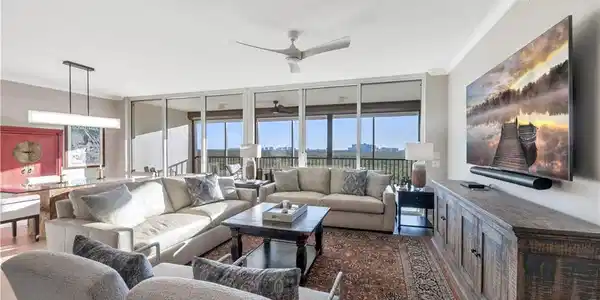 Image 3: Living room featuring wood-type flooring, plenty of natural light, crown molding, and ceiling fan