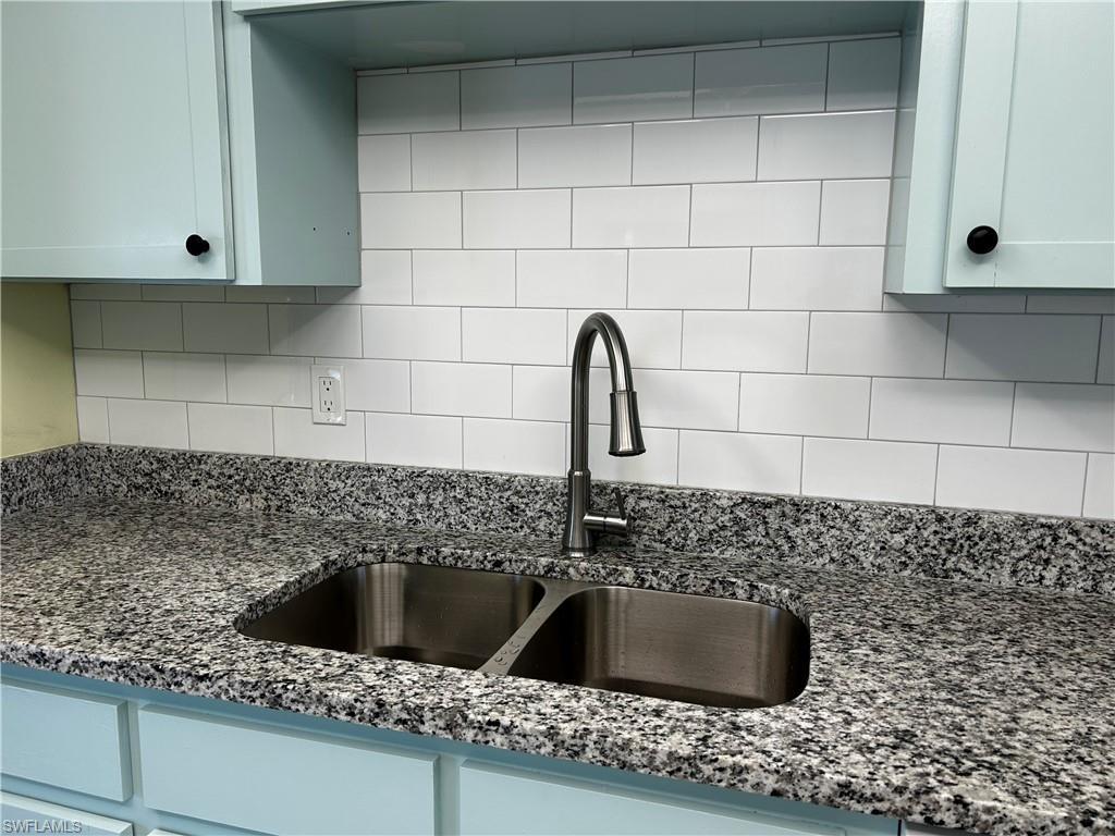 Image 4: New Granite tops in kitchen, new faucet, new sink, new microwave, new tiled backsplash and new cabinet doors