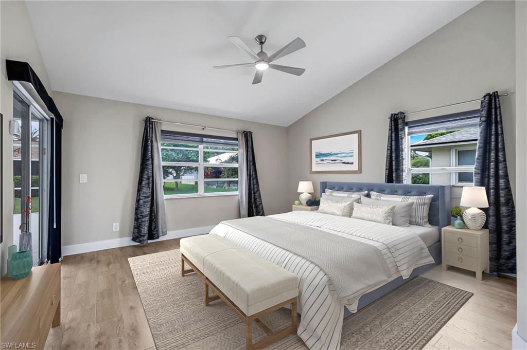 Image 4: Virtually Staged Primary Bedroom with Sliding Door to Pool