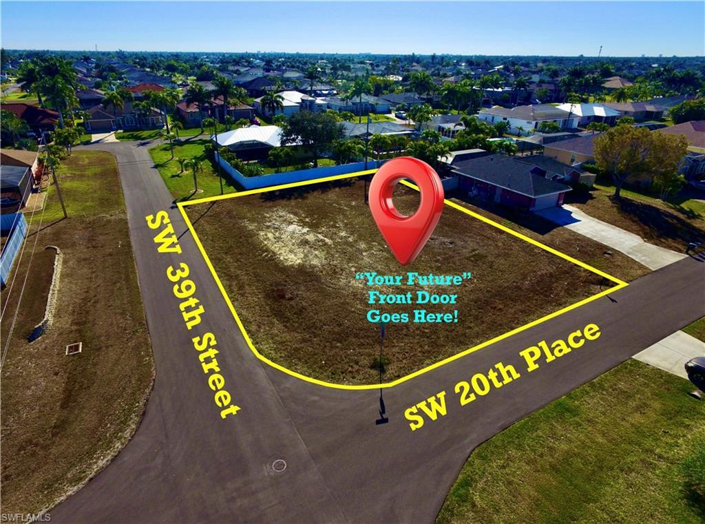 Image 2: Aerial view of residential area featuring property parcel outlined