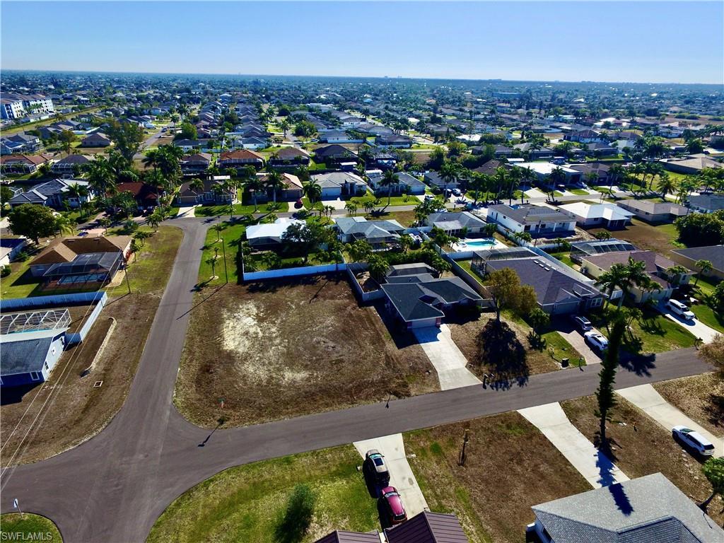 Image 4: Aerial overview of property's location with nearby suburban area