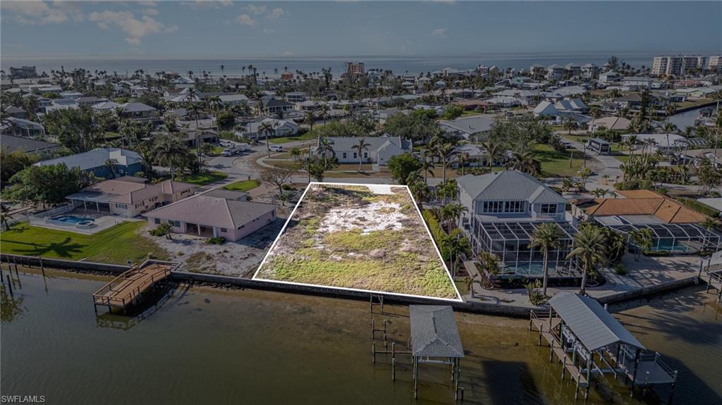 Image 3: Spectacular oversized buildable Bayfront lot at just over a third of an acre on Estero Bay Estuary and close to the sparkling gulf waters and sugary white sand of Fort Myers Beach!