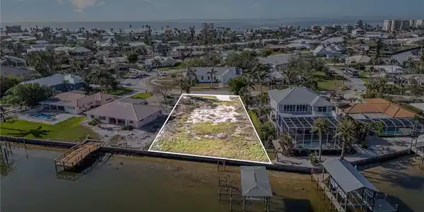 Image 3: Spectacular oversized buildable Bayfront lot at just over a third of an acre on Estero Bay Estuary and close to the sparkling gulf waters and sugary white sand of Fort Myers Beach!