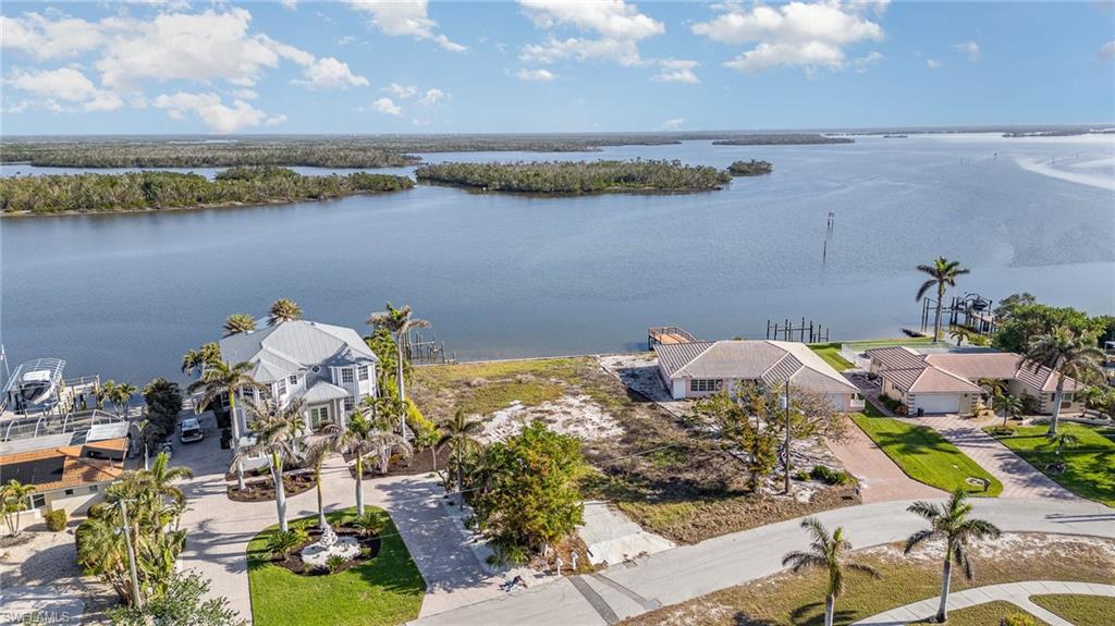 Image 4: Aerial View of oversized (.35 acre) Bay Front Residential lot ready for a new Coastal Home with a View!