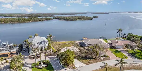 Image 4: Aerial View of oversized (.35 acre) Bay Front Residential lot ready for a new Coastal Home with a View!