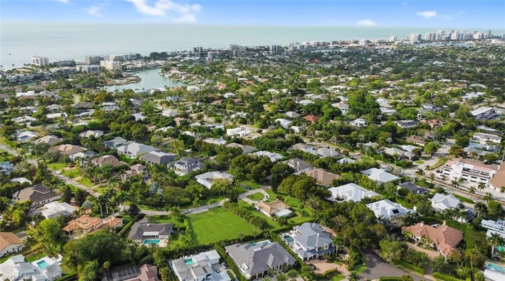 Image 4: View of urban area featuring a nearby body of water and nearby suburban area