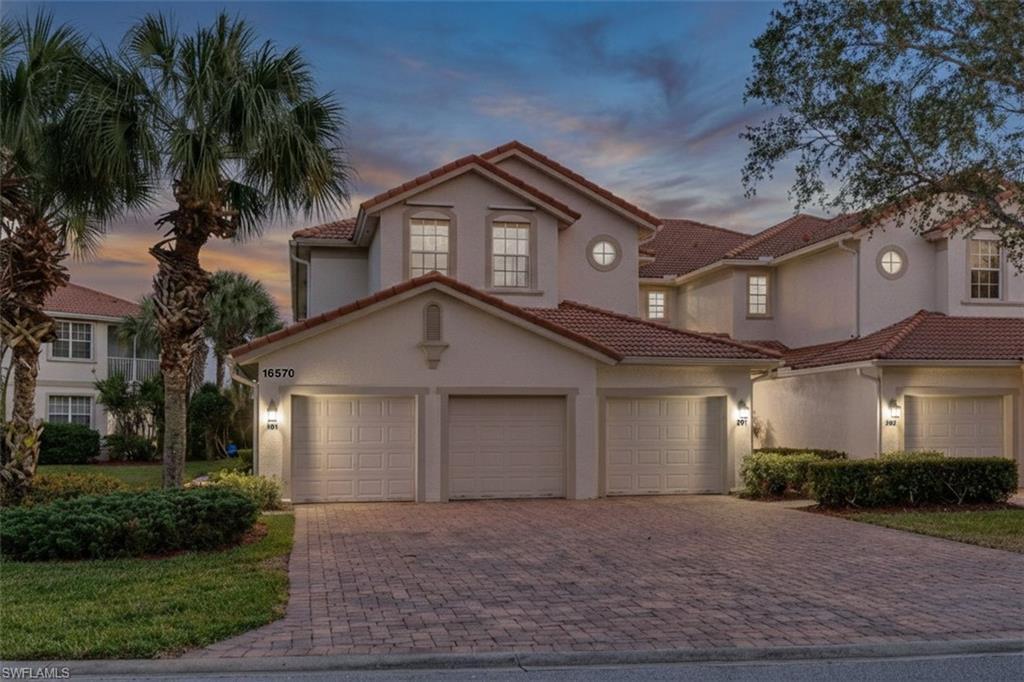 Image 3: Mediterranean / spanish house featuring decorative driveway, stucco siding, and a tiled roof