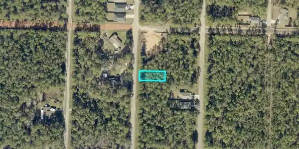 Image 3: Aerial View. Displaying the property's boundaries within the surrounding land parcel