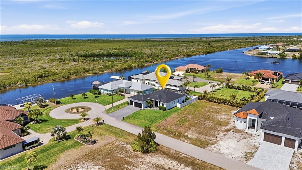 Image 4: Home surrounded by gulf access homes at the end of a quiet street