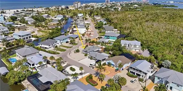 Image 2: Aerial perspective showcasing the home and walking distance to the BEACH!! YAY!!