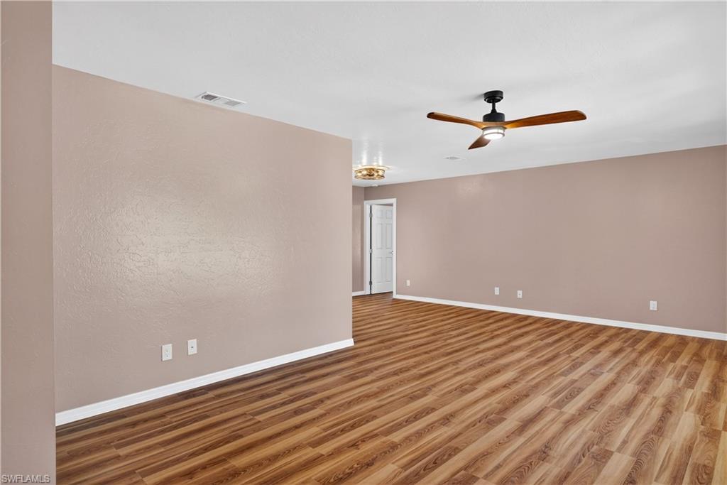 Image 3: Front Living Room with view of Dining Area