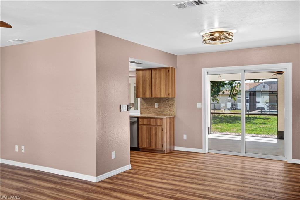 Image 4: View from front Living Room of Dining Area and entrance to Kitchen