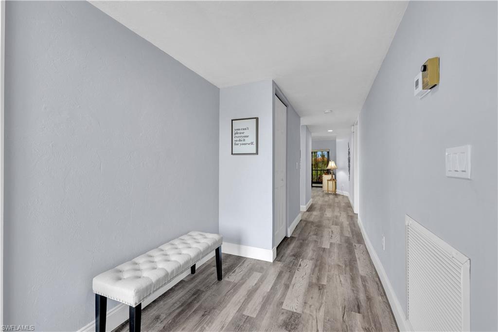 Image 4: Hallway with light wood finished floors and baseboards