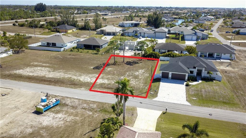 Image 1: Aerial view of residential area with property boundaries highlighted