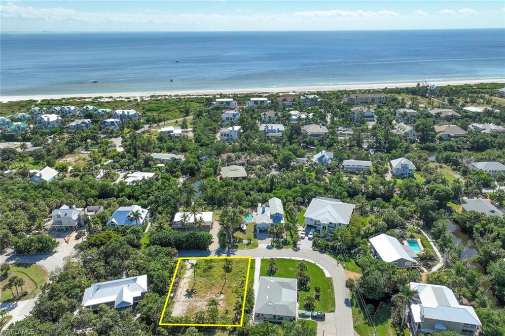Image 4: Aerial view of property's location featuring nearby suburban area and property parcel outlined