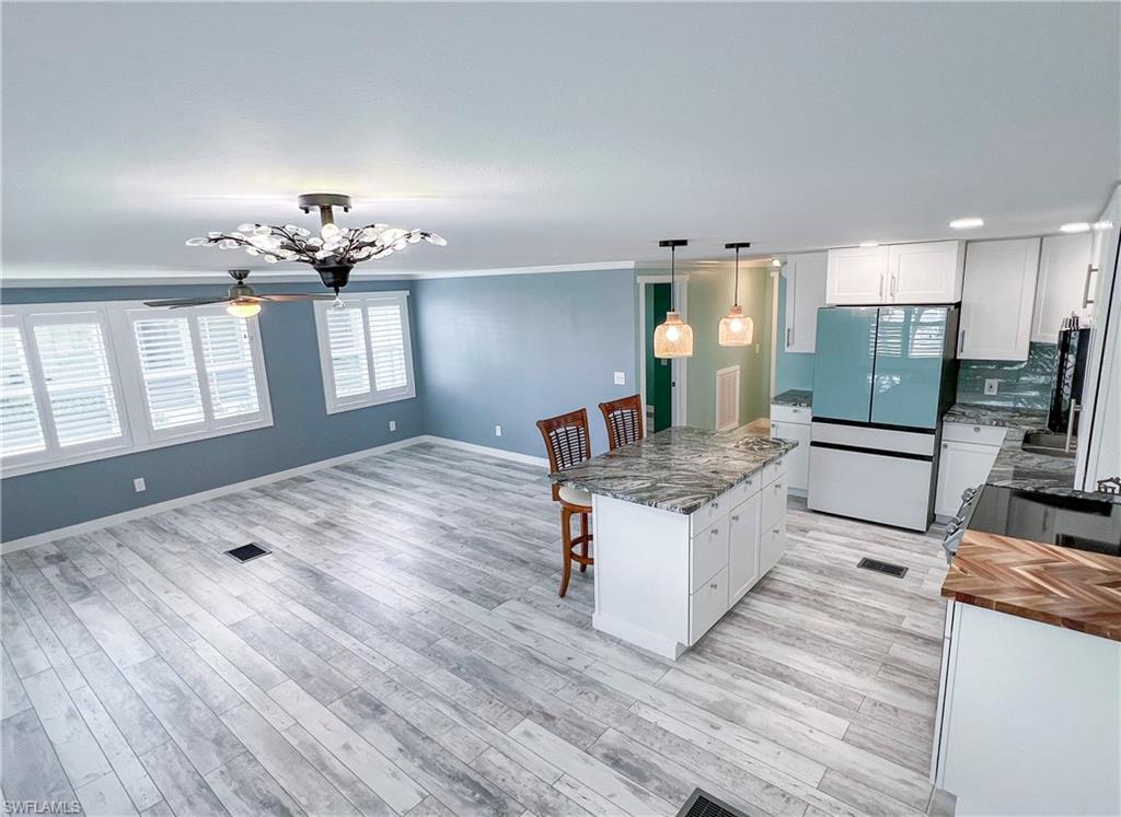 Image 4: Open concept living, dining and kitchen