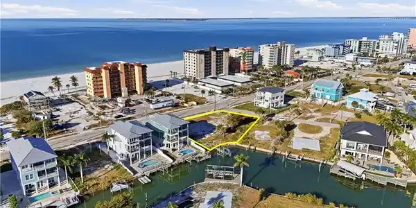 Image 3: Aerial view of a large body of water and apartment complex - Virtually Edited Image