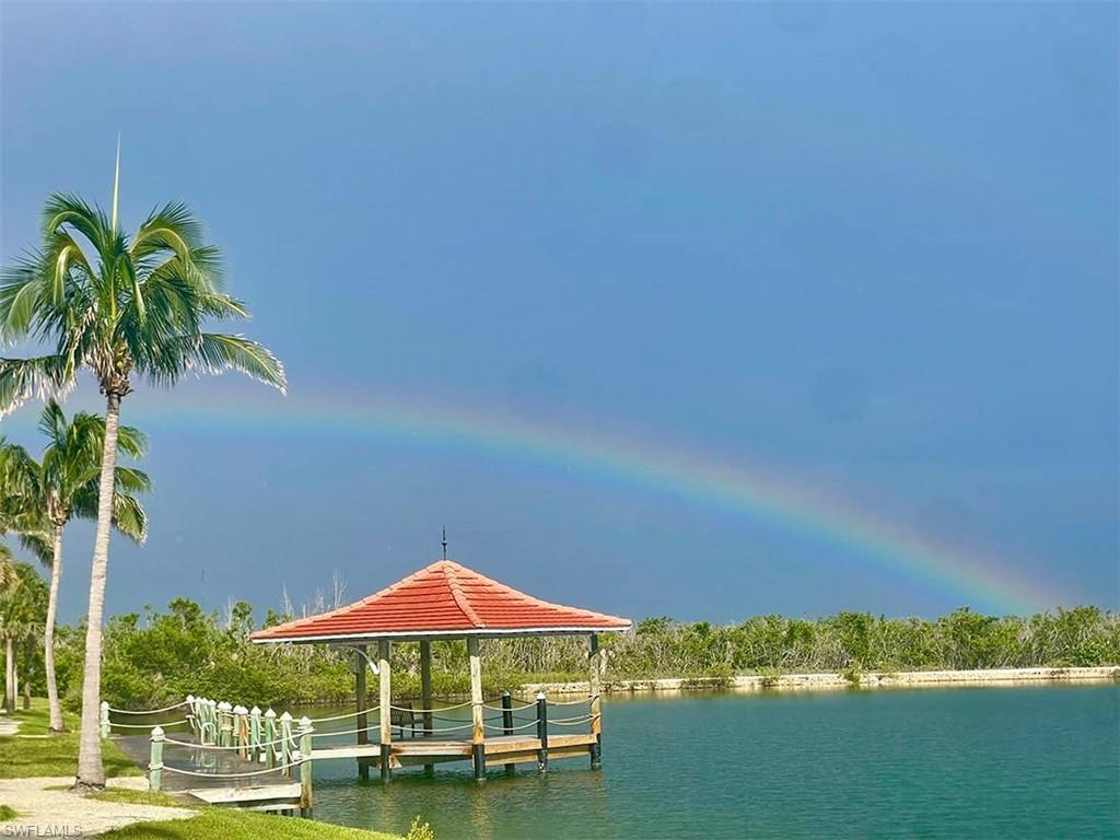 Image 1: A rainbow welcomes you home to luxury lakeside living