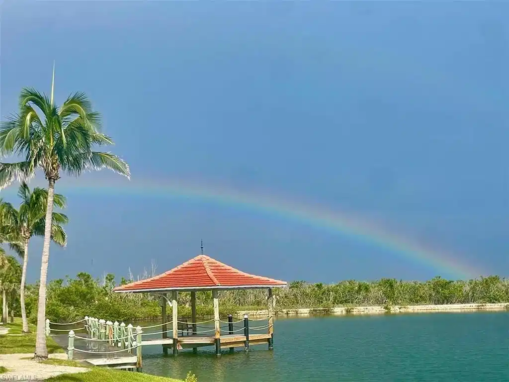 Image 1: A rainbow welcomes you home to luxury lakeside living