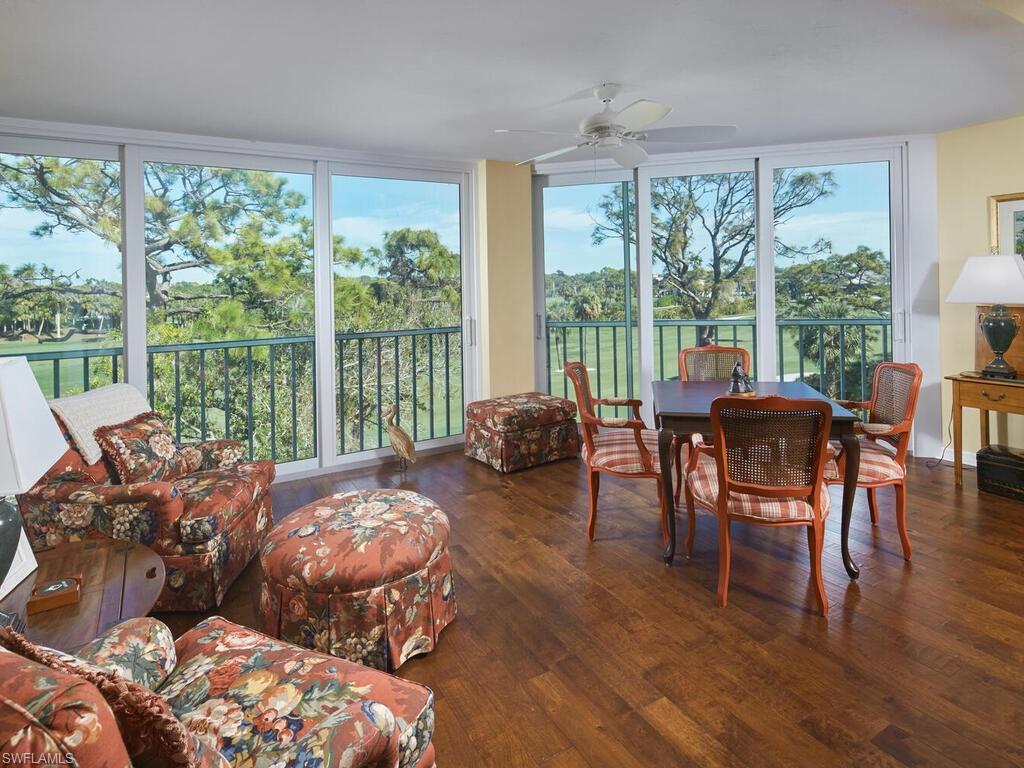 Image 2: Glassed in lanai with impact glass sliders and lovely wood floors