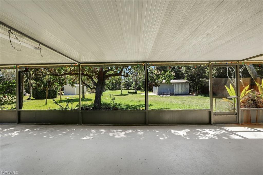 Image 4: Large, screened-in lanai spanning the length of the home