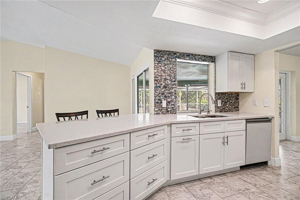 Image 2: Newer Kitchen cabinets, quartz countertops, and appliance