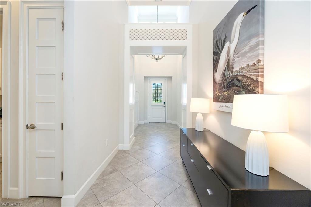 Image 2: Elegant entry with volume ceilings, wainstcoting panels and elevated styling treatments