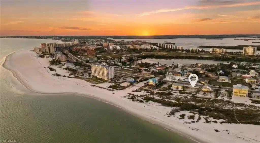 Image 1: View of urban area with expansive beach