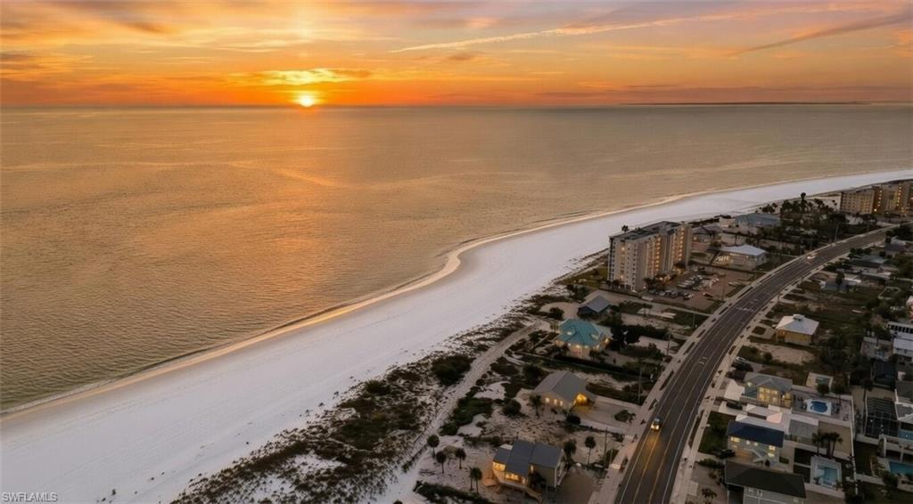 Image 3: Aerial view at dusk of view of water and beach