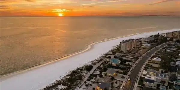 Image 3: Aerial view at dusk of view of water and beach