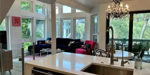 Image 2: Open-concept kitchen and living area.