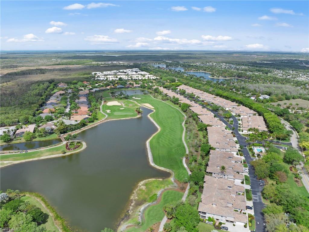 Image 2: View of property location with nearby suburban area, a large body of water, and a golf club