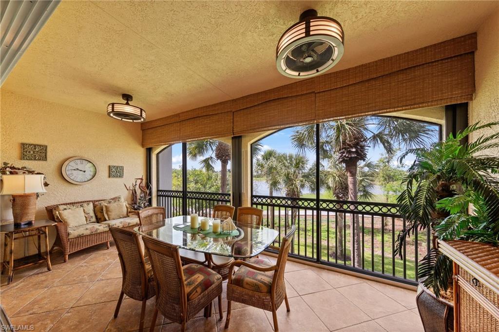 Image 3: Sunroom with a textured wall, a textured ceiling, and tile patterned flooring