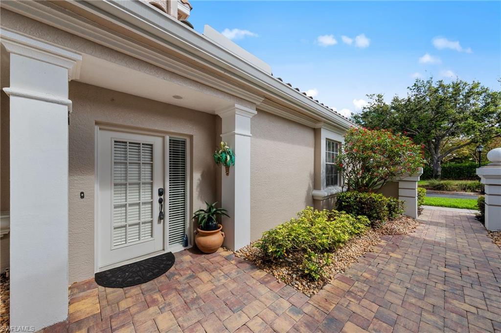 Image 4: View of exterior entry with stucco siding