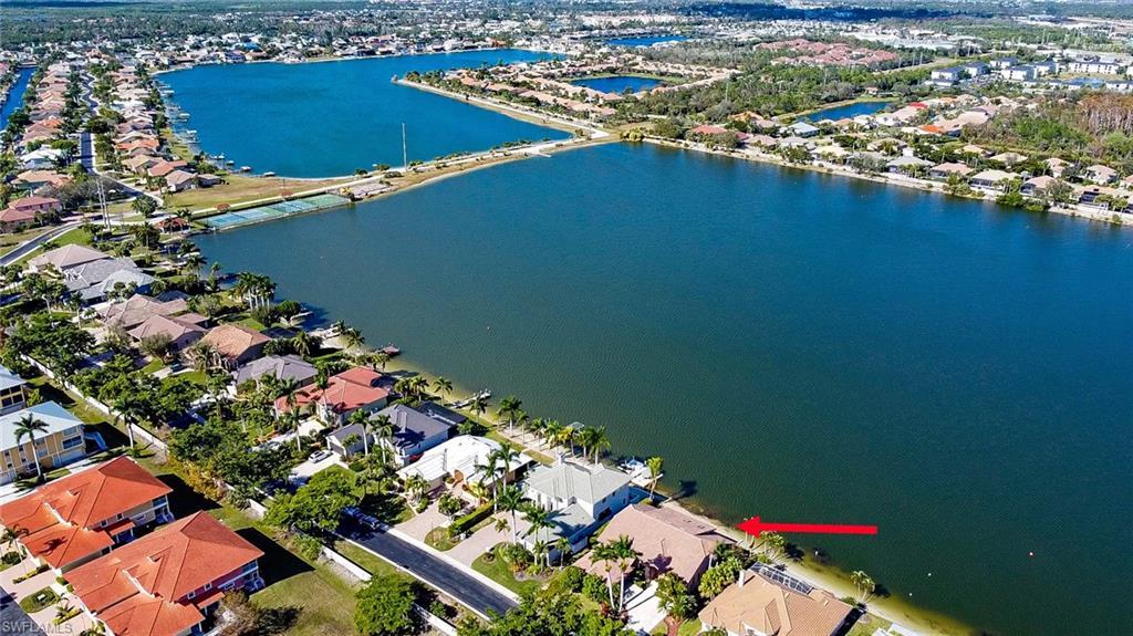 Image 4: Waterfront property featuring a private boat dock, direct water access, and a spacious outdoor area