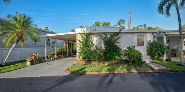 Image 2: Front of home featuring Carport