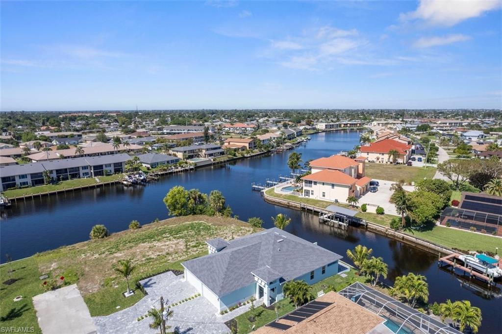Image 4: Birds eye view of property featuring a residential view and a water view