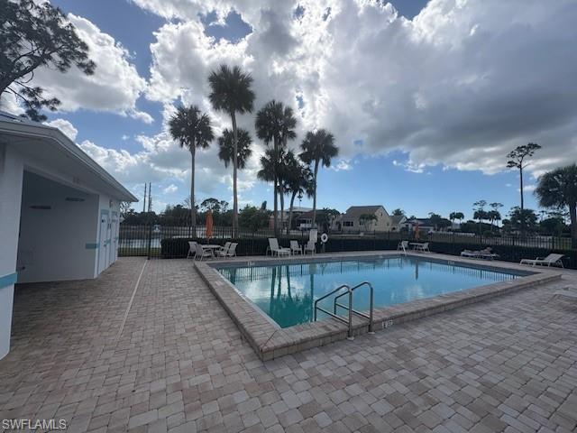 Image 3: Community pool featuring a patio area