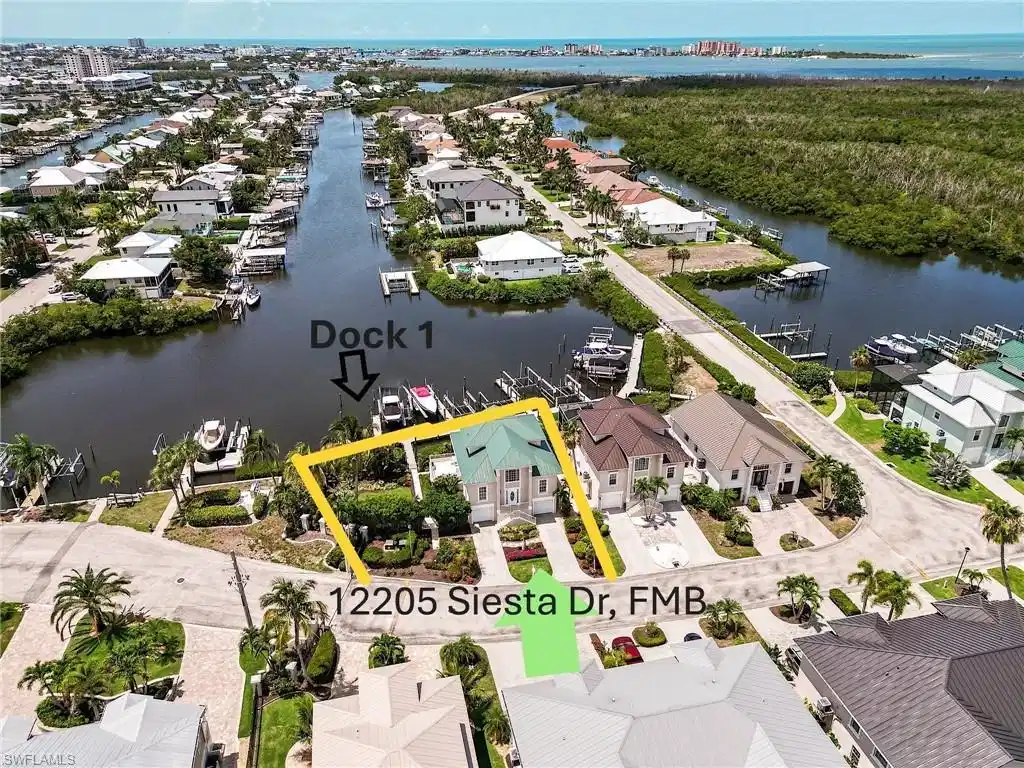 Image 1: Southern exposure 1.5-lot parcel in the secure, gated enclave of Old Pelican Bay in Fort Myers Beach, the Boater & Fisherman's Paradise.  With it's  bonus rooms, the home offers over 2300 sq ft of living space under air.