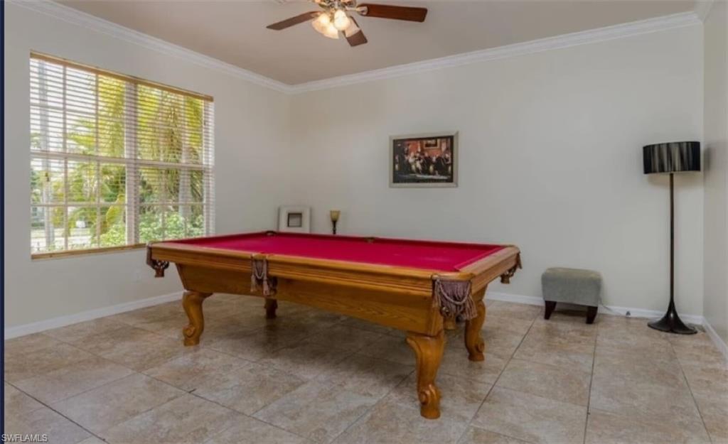 Image 4: Playroom with billiards, plenty of natural light, and ceiling fan