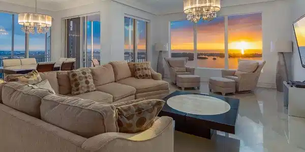 Image 4: Living area featuring a chandelier, crown molding, and tile patterned floors