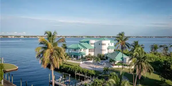 Image 2: Water view featuring a boat dock and boat lift