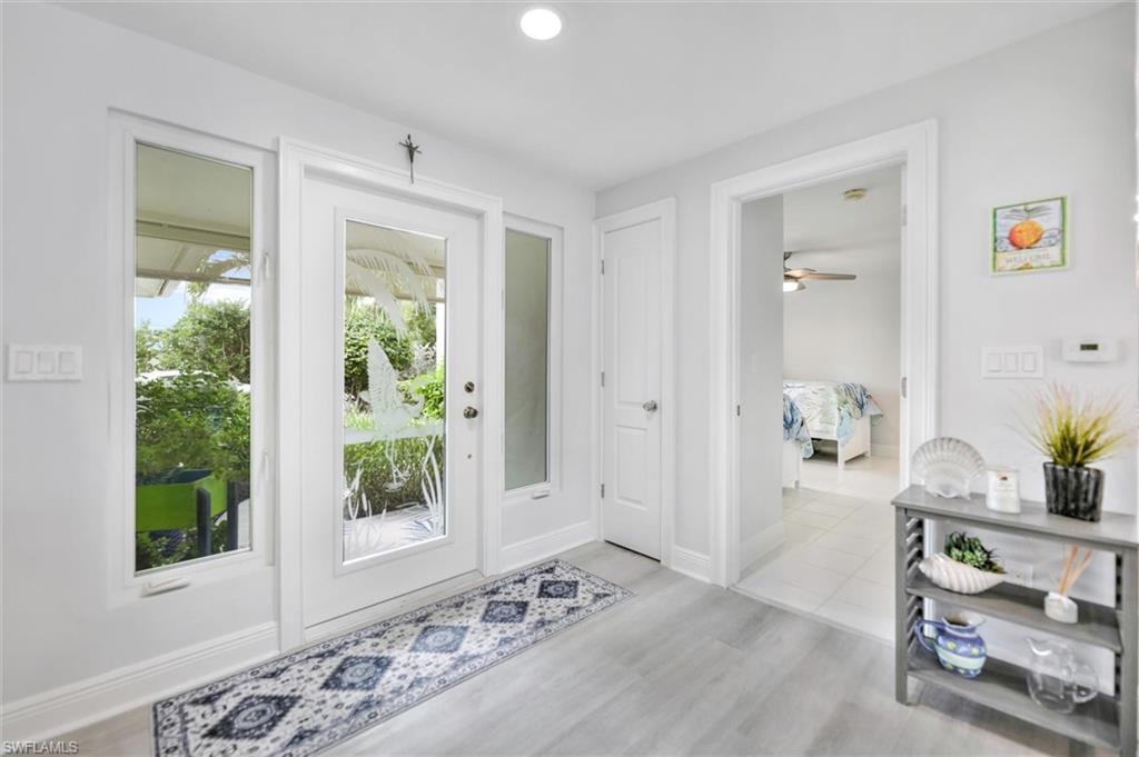 Image 4: Doorway featuring wood finished floors and recessed lighting