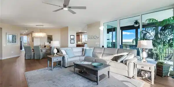 Image 4: Spacious grand salon with floor to ceiling sliding glass doors and gorgeous views.